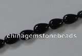CAB744 15.5 inches 6*8mm flat teardrop black agate gemstone beads