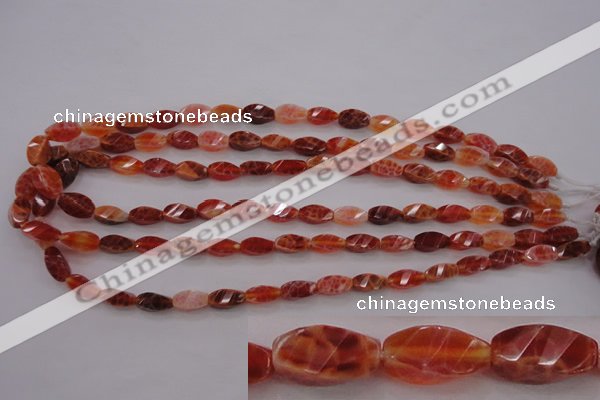 CAG4180 15.5 inches 6*12mm faceted & twisted rice natural fire agate beads
