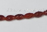 CAA124 15.5 inches 6*10mm faceted rice red agate gemstone beads