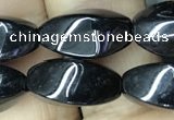 CAA2482 15.5 inches 6*12mm twisted rice black agate beads