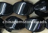 CAA2486 15.5 inches 10*14mm twisted rice black agate beads