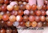 CAA6155 15 inches 14mm round orange Botswana agate beads