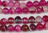CAG2085 15.5 inches 6mm faceted round fuchsia line agate beads