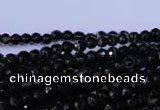 CAG2312 15.5 inches 4mm faceted round black line agate beads