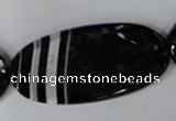 CAG3086 15.5 inches 25*50mm faceted oval black line agate beads