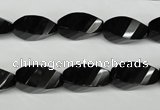 CAG4009 15.5 inches 8*16mm faceted & twisted rice black agate beads