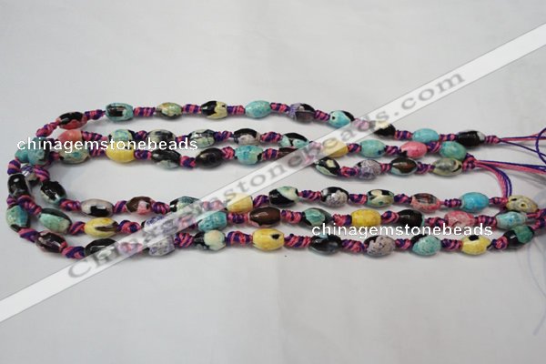 CAG5770 15 inches 6*9mm faceted rice fire crackle agate beads