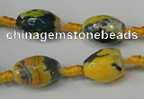 CAG5774 15 inches 10*14mm faceted rice fire crackle agate beads