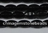 CAG6029 15.5 inches 6*10mm faceted rice matte black agate beads