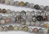 CAG7870 15.5 inches 4mm faceted round silver needle agate beads