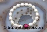 CFB916 9mm - 10mm rice white freshwater pearl & red tiger eye stretchy bracelet