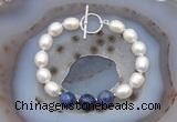 CFB930 Hand-knotted 9mm - 10mm rice white freshwater pearl & sodalite bracelet