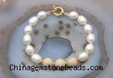 CFB946 Hand-knotted 9mm - 10mm rice white freshwater pearl & white fossil jasper bracelet