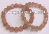 CGB4587 7.5 inches 8mm - 9mm round sunstone beaded bracelets