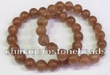 CGB4609 10mm - 11mm round golden rutilated quartz beaded bracelets