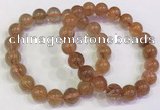 CGB4614 10mm - 11mm round golden rutilated quartz beaded bracelets