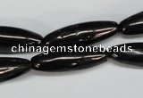 CJB54 15.5 inches 10*30mm rice natural jet gemstone beads