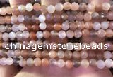 CMS1890 15.5 inches 5.5mm faceted round rainbow moonstone beads