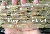 CRI132 15.5 inches 10*30mm faceted rice lemon quartz beads