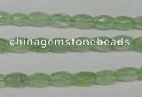 CRU165 15.5 inches 5*8mm faceted rice green rutilated quartz beads