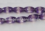 CSA25 15.5 inches 7*12mm faceted rice synthetic amethyst beads