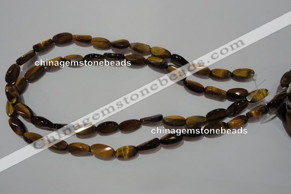 CTE1097 15.5 inches 8*15mm twisted & faceted oval yellow tiger eye beads