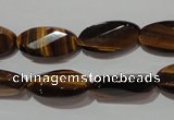 CTE1098 15.5 inches 10*20mm twisted & faceted oval yellow tiger eye beads