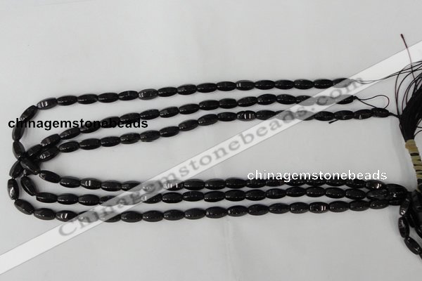 CTO116 15.5 inches 5*10mm faceted rice black tourmaline beads