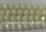 CTU1440 15.5 inches 4mm faceted round synthetic turquoise beads