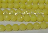 CTU2523 15.5 inches 4mm faceted round synthetic turquoise beads
