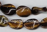 CTW69 15.5 inches 15*20mm twisted oval yellow tiger eye beads